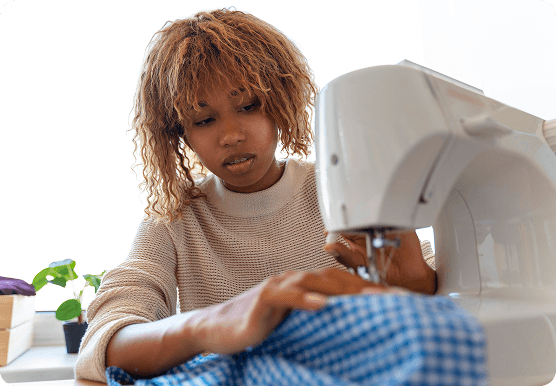 Young entrepreneur using a sewing machine